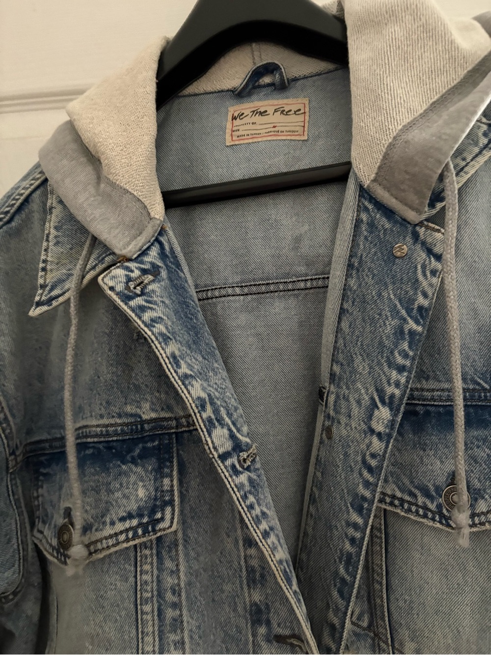 We The Free Light Wash Distressed Denim Jacket with Gray Hood